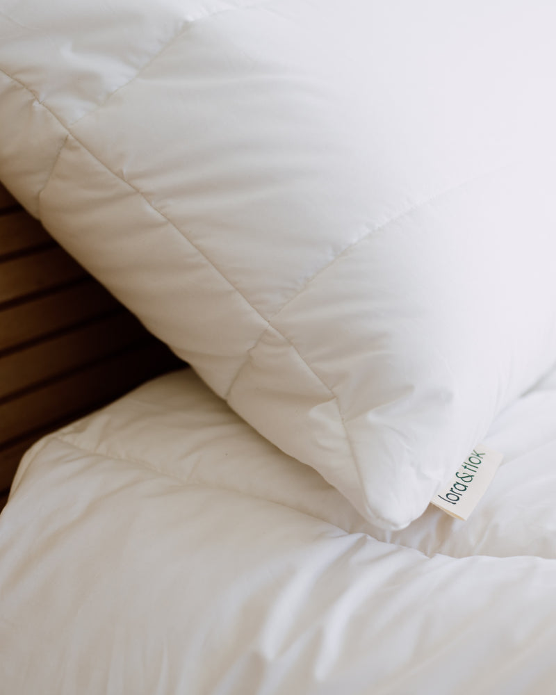 Cotton and wool quilted bed pillow shell filled with New Zealand wool by Lora & Flok.